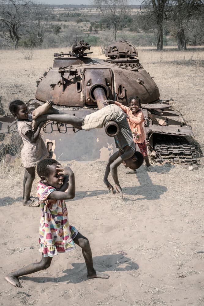 African Children Playing Tank by Trevor Cole — canvas wall art