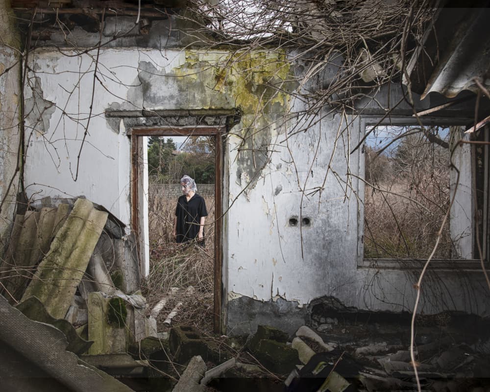 Woman In Ruined Doorway by Hooman Sedaghi — canvas wall art