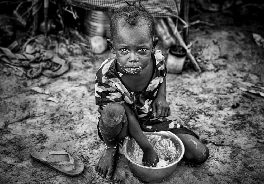 Young Boy's Meal by Joxe Inazio Kuesta Garmendia — canvas wall art