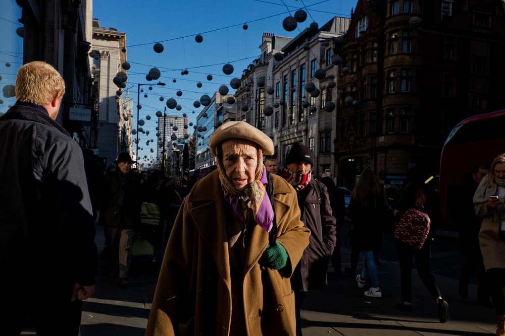 Elderly Woman City Gaze by Lorenzo Grifantini — canvas wall art
