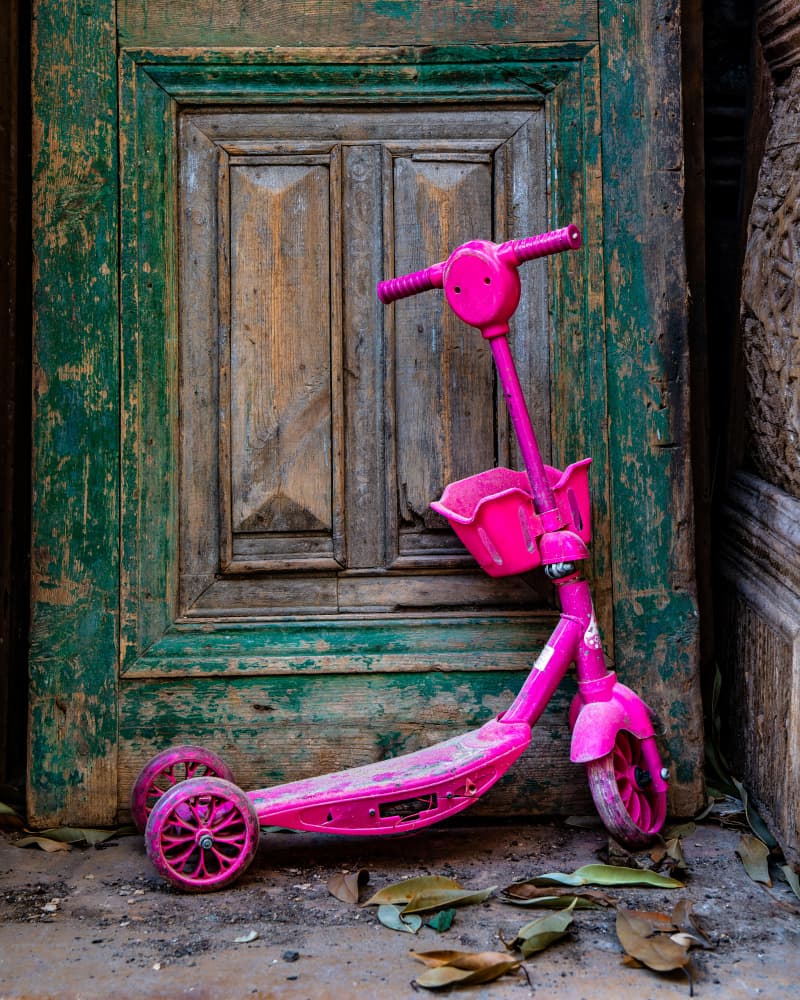 Rustic Door Pink Scooter by Gilad Topaz — canvas wall art