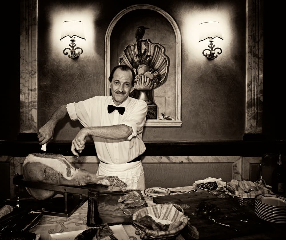 Old World Chef Carving Ham by Julien Oncete — canvas wall art