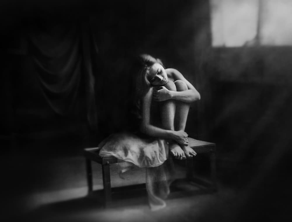 Pensive Woman Seated by Sebastian Kisworo — canvas wall art