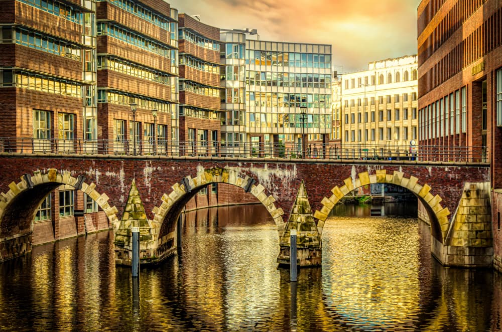 Golden Canal City Reflections by Dieter Walther — canvas wall art