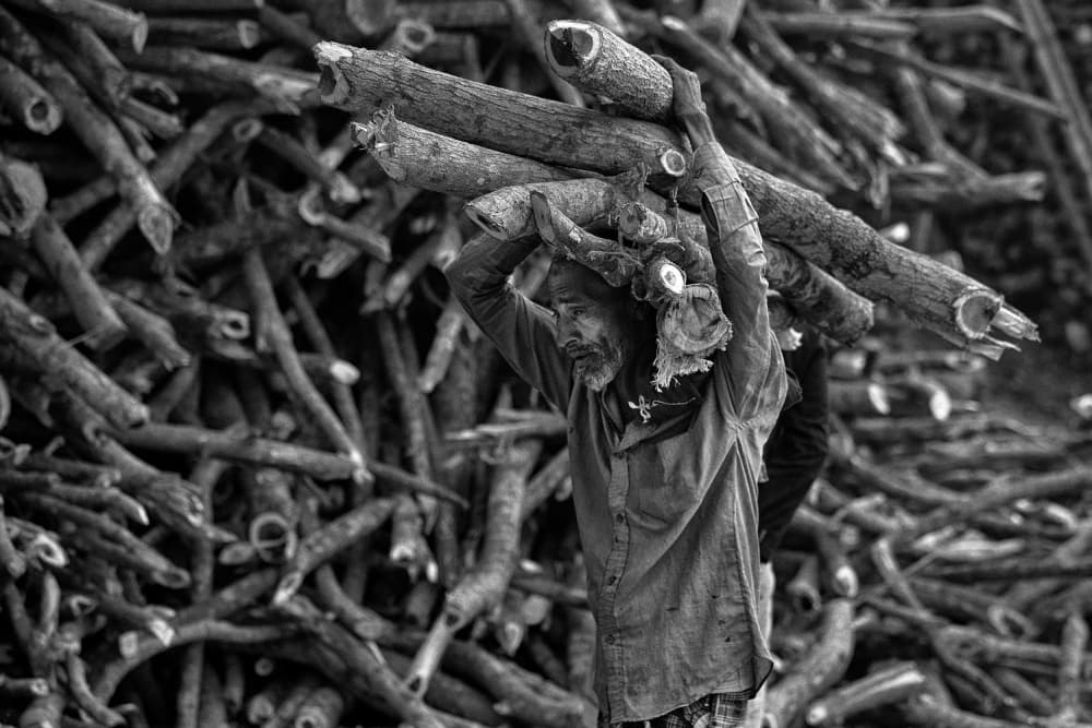 Man Carrying Wood by Garik — canvas wall art