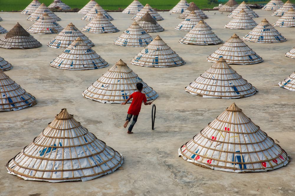 Boy Running Hoop Cones by Azim Khan Ronnie — canvas wall art