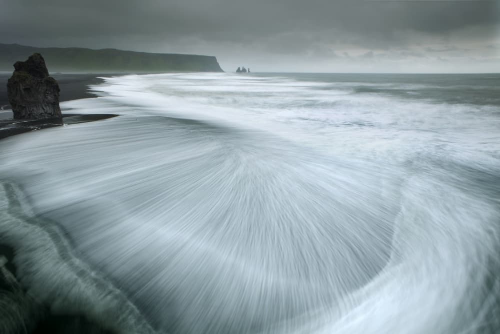 Moody Black Sand Beach by Nicolas Schumacher — canvas wall art