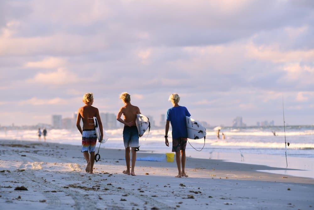 Golden Hour Surfers by Victor Zhang — canvas wall art