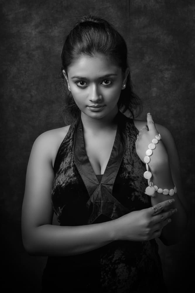 Elegant Woman with Beads by PARTHA BHATTACHARYYA — canvas wall art