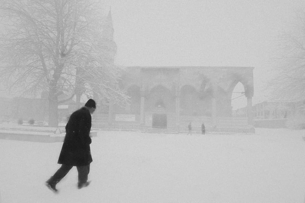 Man Walking Snowy Path by Murat YILMAZ — canvas wall art