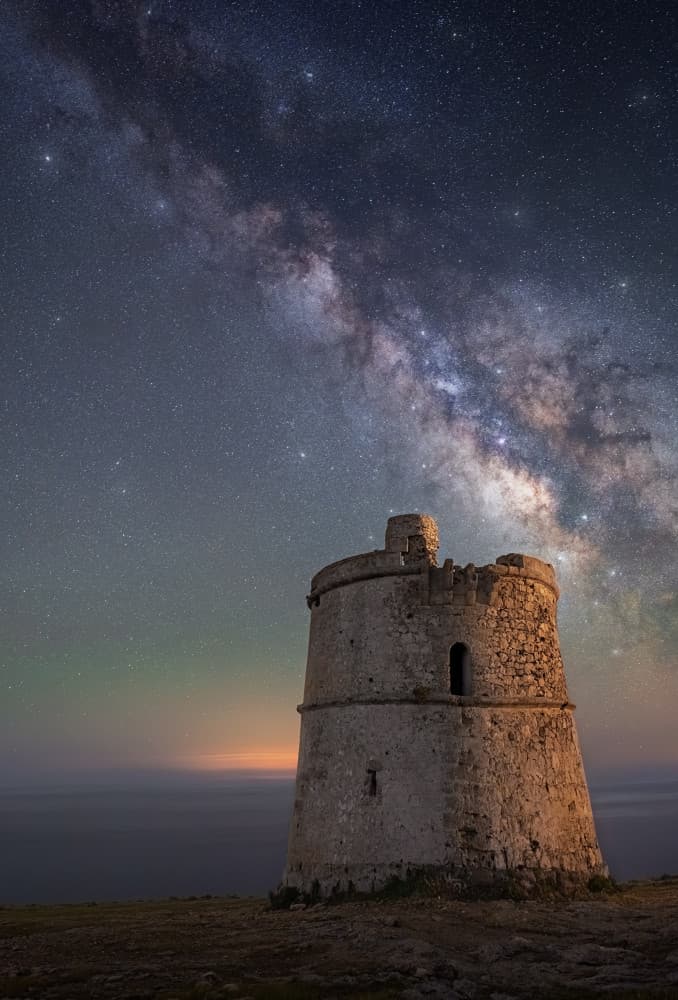 Milky Way Over Ancient Tower by joanaduenas — canvas wall art
