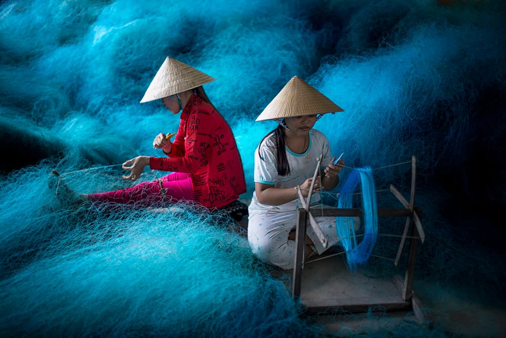 Vietnamese Net Weavers by Burak Senbak — canvas wall art