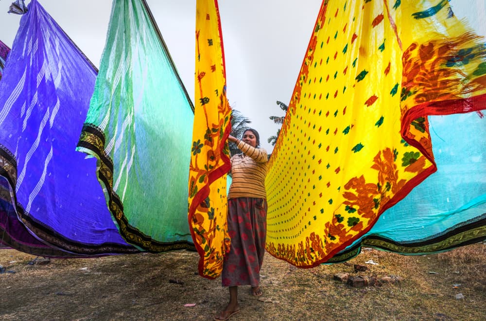 Vibrant Saris Drying by Prithul Das — canvas wall art