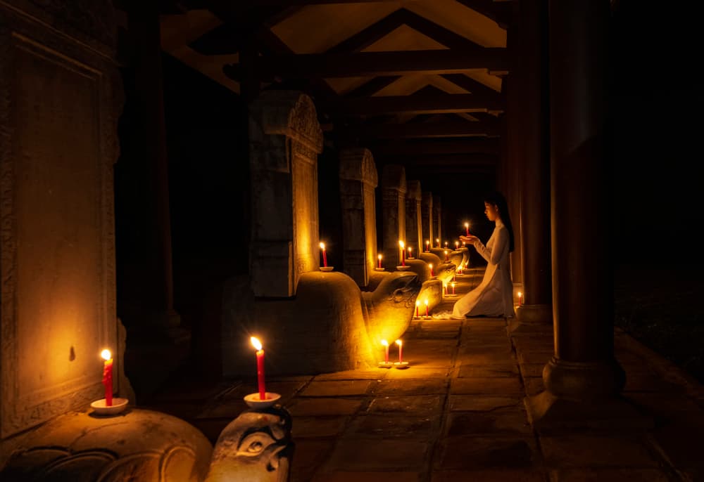Woman in Candlelit Temple by Handi Nugraha — canvas wall art