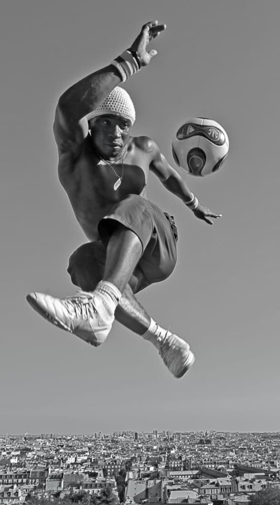 Freestyle Football Above City by Rodrigo Marin — canvas wall art