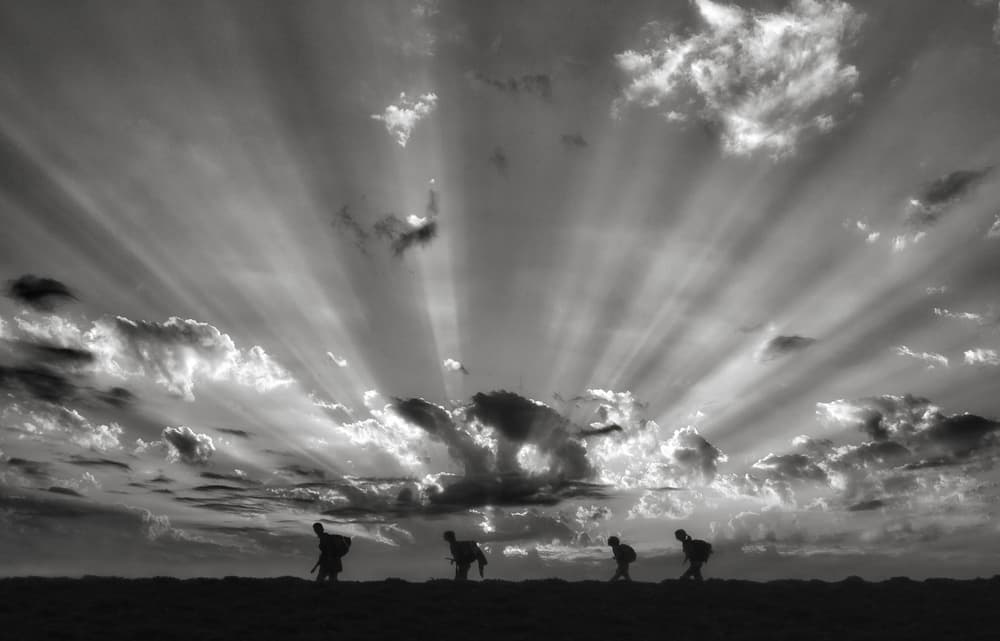 Silhouettes Under Sun Rays by Yvette Depaepe — canvas wall art