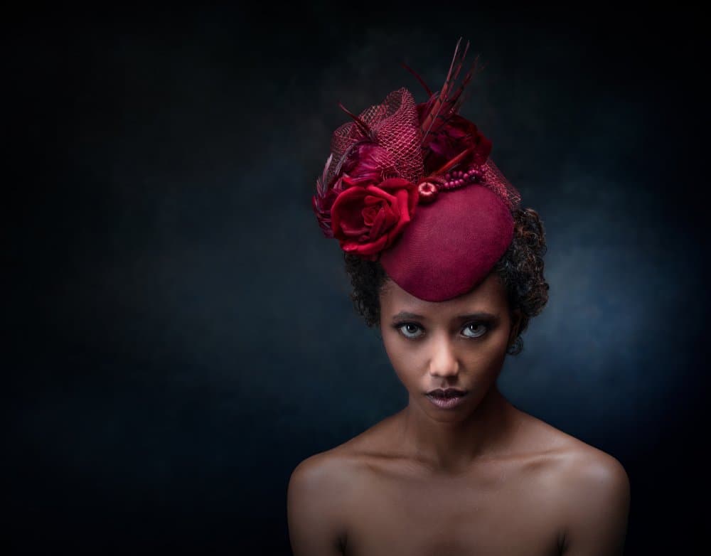 Elegant Red Hat Portrait by Luc Stalmans — canvas wall art