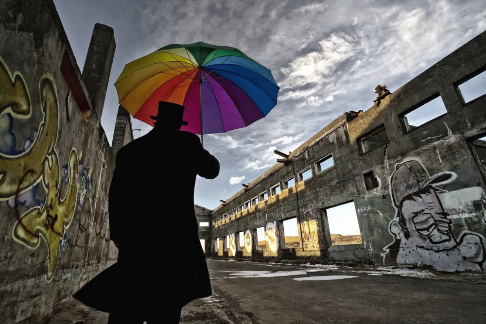 Man With Rainbow Umbrella by Þorsteinn H. Ingibergsson — canvas wall art