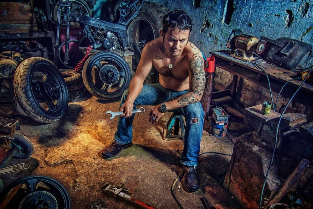 Motorcycle Mechanic Workshop by Ivan Valentino — canvas wall art