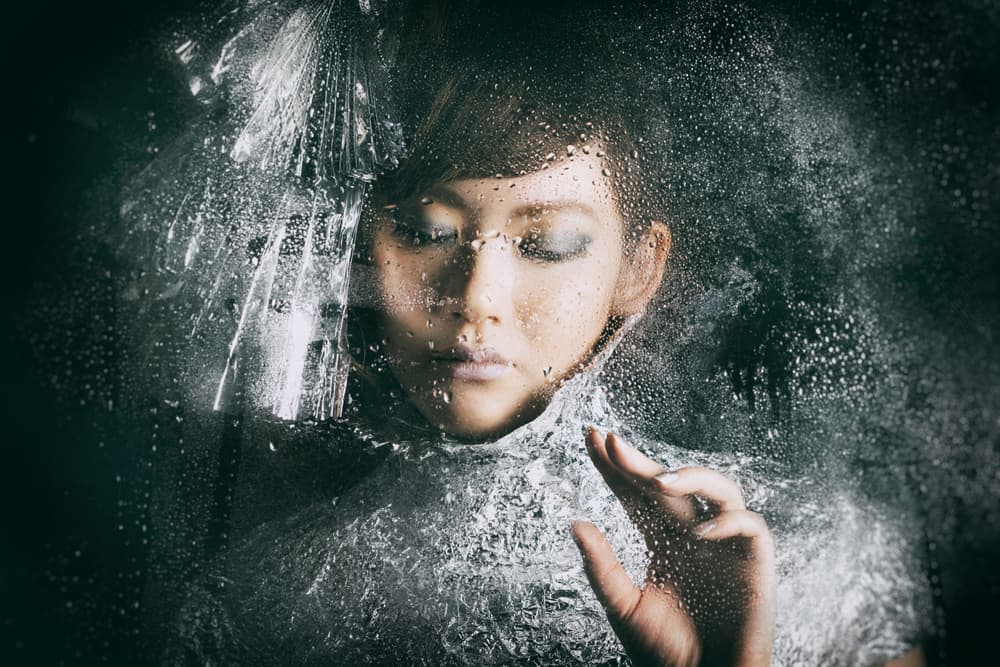 Woman Behind Raindrops by Daisuke Kiyota — canvas wall art