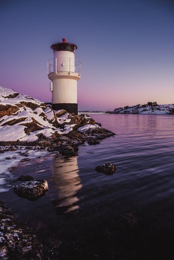 Serene Winter Lighthouse by Dan Larsson — canvas wall art
