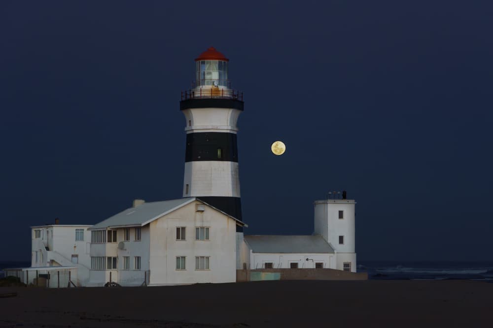 Lighthouse Under Full Moon by Etienne Steenkamp — canvas wall art