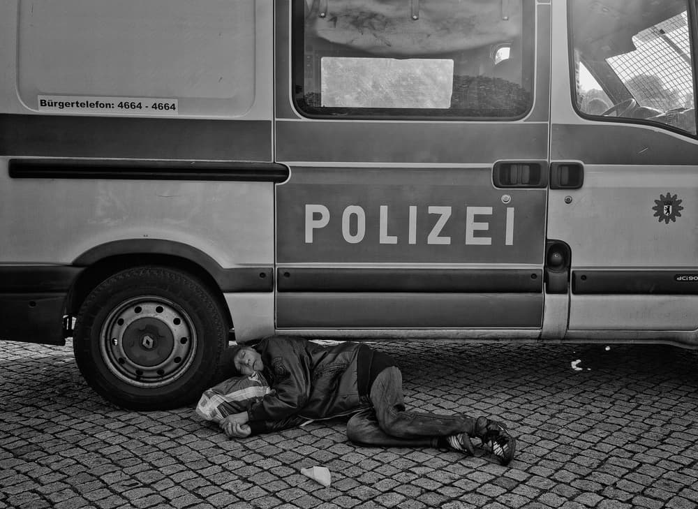 Homeless Man Police Van by Lorenzo Grifantini — canvas wall art