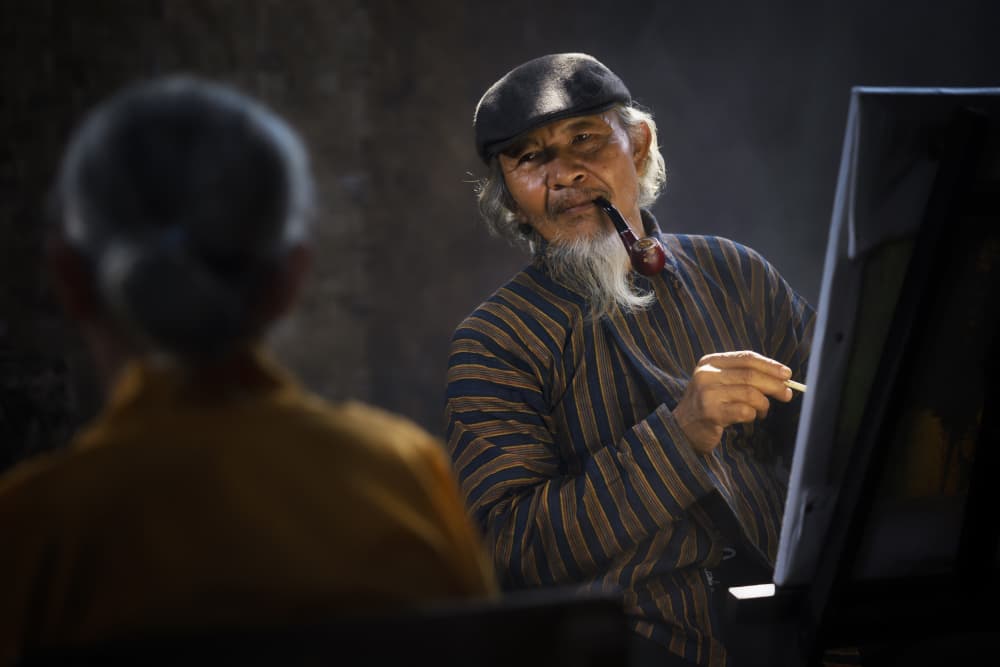 Elder Artist with Pipe by Rini Widyantini — canvas wall art