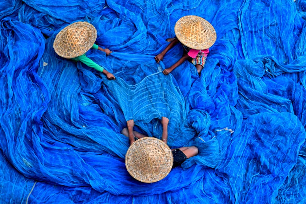 Blue Nets and Straw Hats by Avishek Das — canvas wall art