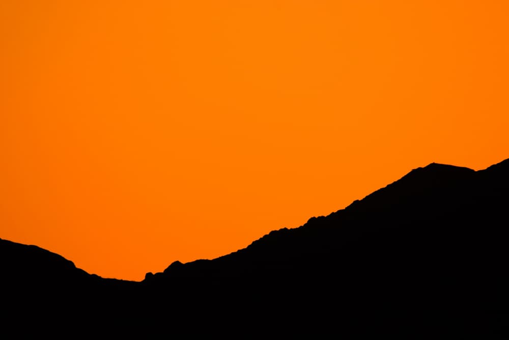 Orange Mountain Silhouette by Tal Paz-Fridman — canvas wall art