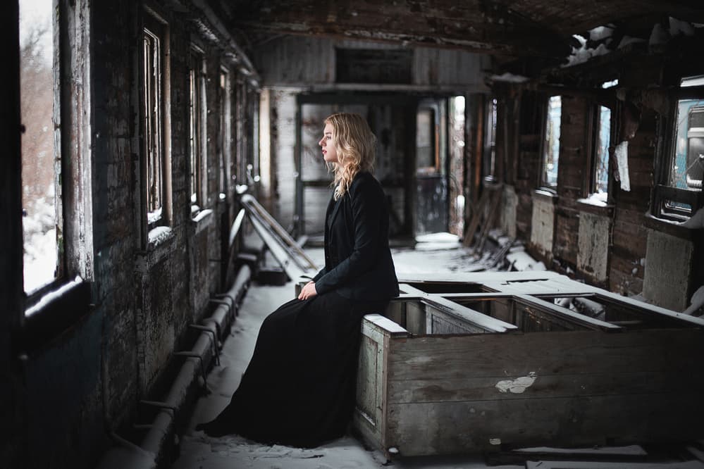 Pensive Woman Winter Train by Borislav Kornienko — canvas wall art