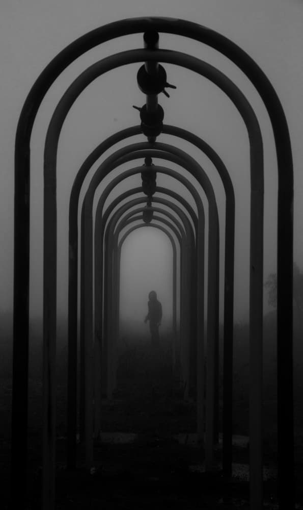 Solitary Figure Foggy Arches by Meraj — canvas wall art