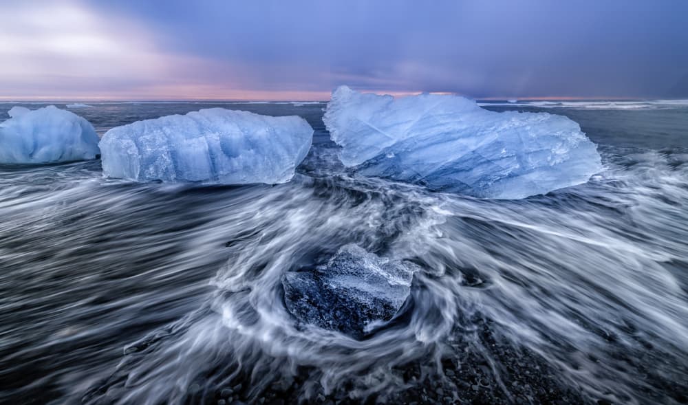 Blue Ice On Black Sand by Alex Lu — canvas wall art