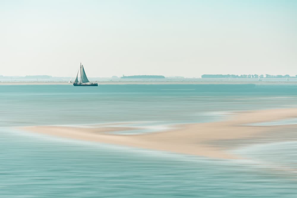 Sailboat on Tranquil Waters by Bernardine de Laat — canvas wall art