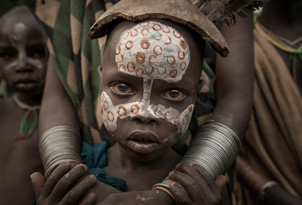 Intense Child Gaze by Sarawut Intarob — canvas wall art