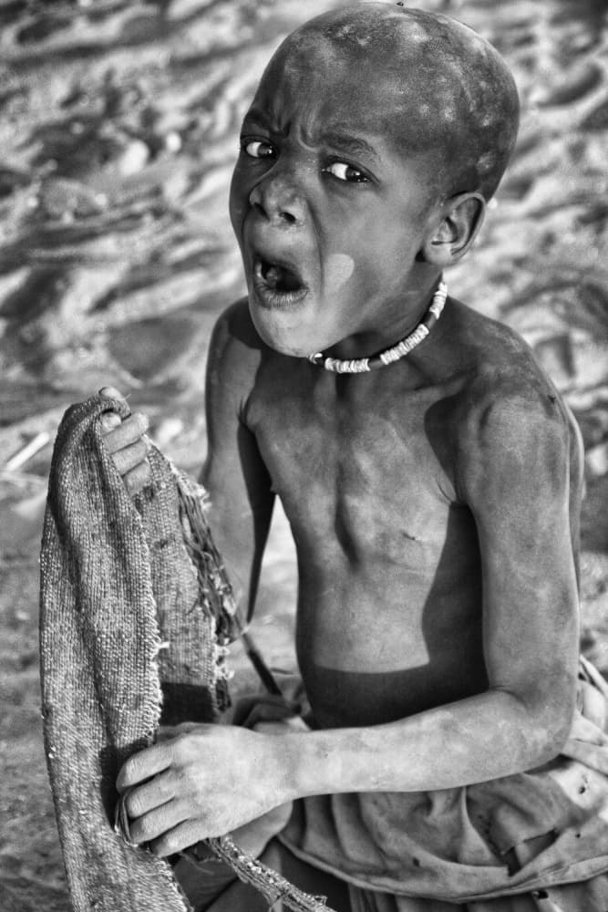 African Boy's Raw Expression by Joxe Inazio Kuesta Garmendia — canvas wall art