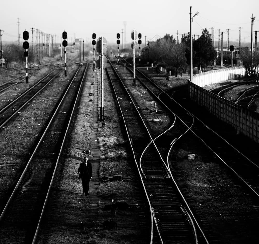 Solitary Man On Tracks by Julien Oncete — canvas wall art