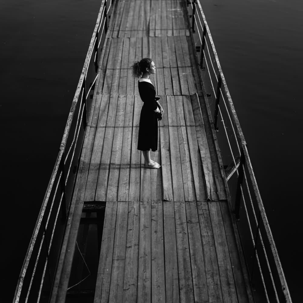 Woman on Wooden Pier by Borislav Kornienko — canvas wall art