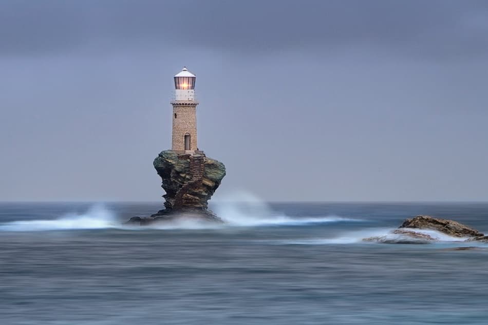 Solitary Lighthouse Glow by Maria Kaimaki — canvas wall art