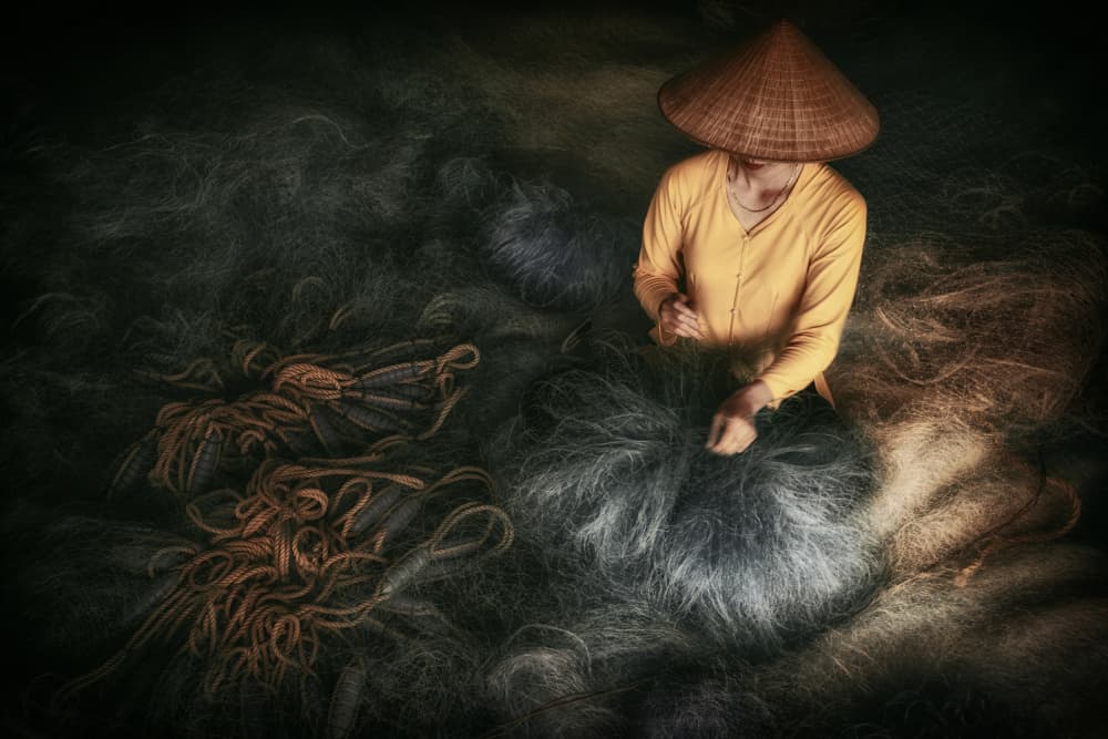 fishing net repair by Pavol Stranak — canvas wall art
