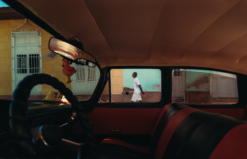 Vintage Taxi Street Scene by Nasser Al-Nasser — canvas wall art