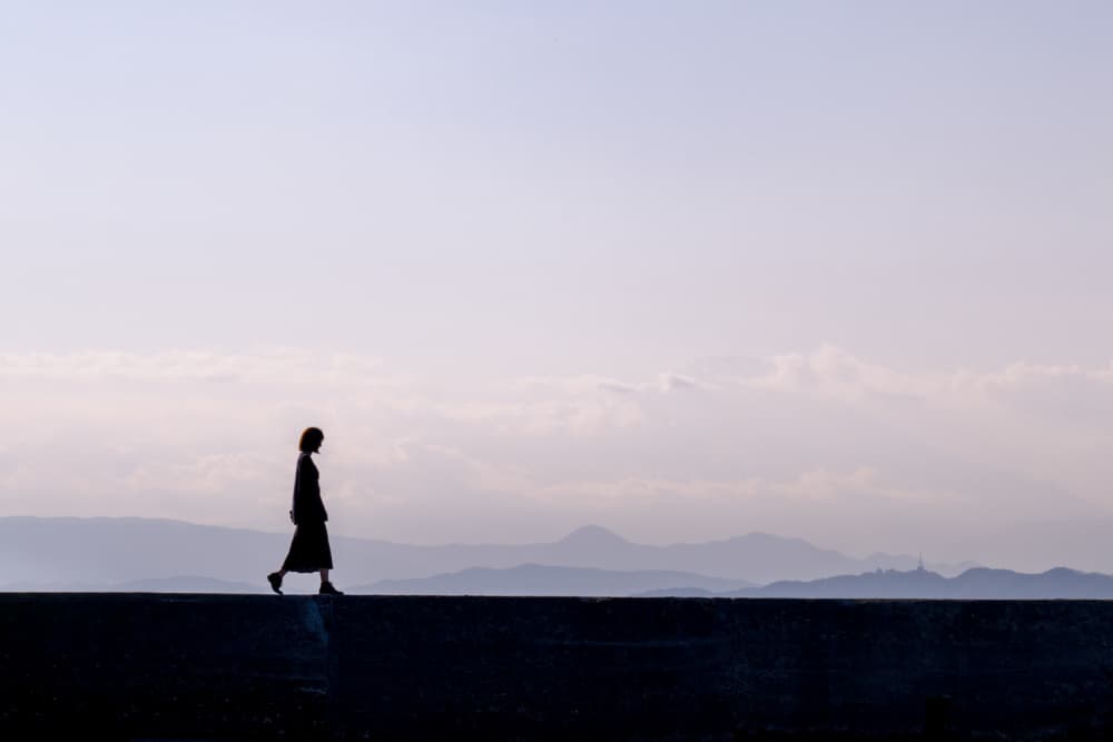 Lone Woman Horizon Walk by YASUTOSHI HONJO — canvas wall art