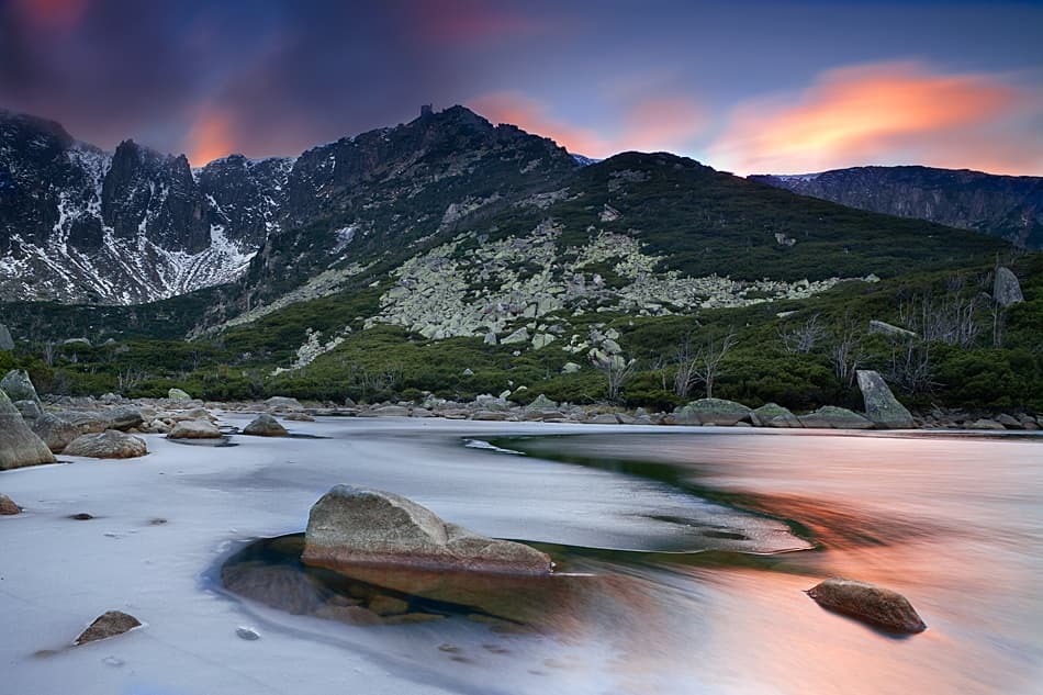 Frozen Mountain Lake Sunset by Lucjan Stoszko — canvas wall art