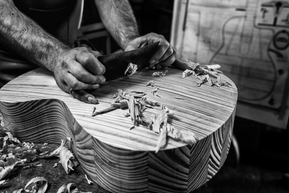 Luthier At Work by Manu Allicot — canvas wall art