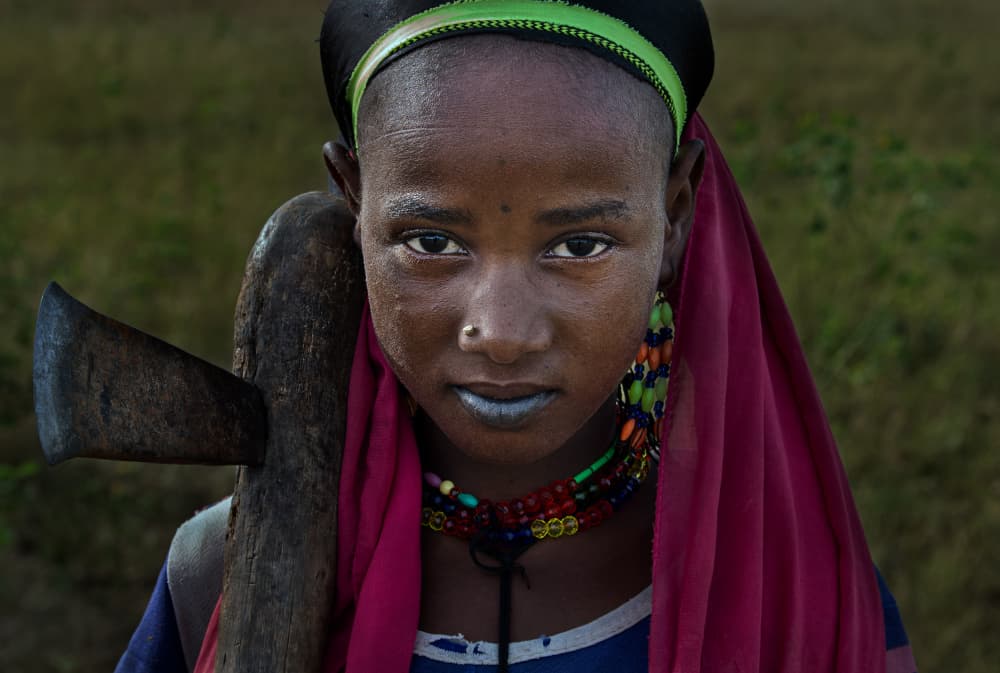 African Girl With Axe by Joxe Inazio Kuesta Garmendia — canvas wall art