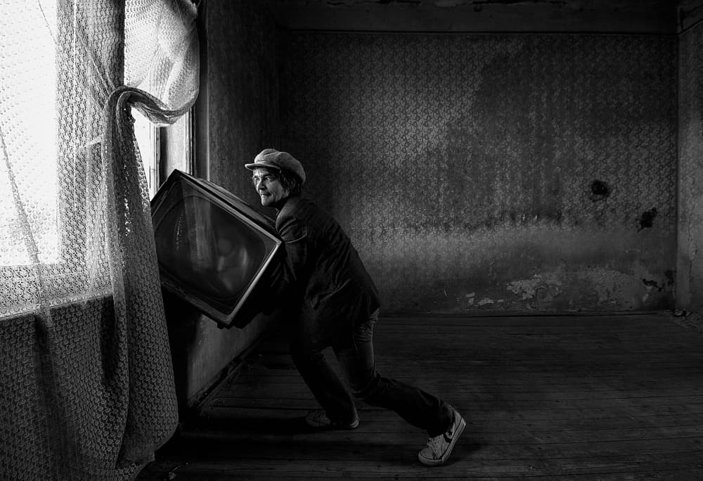 Man Hauling Old Television by mario grobenski - psychodaddy — canvas wall art