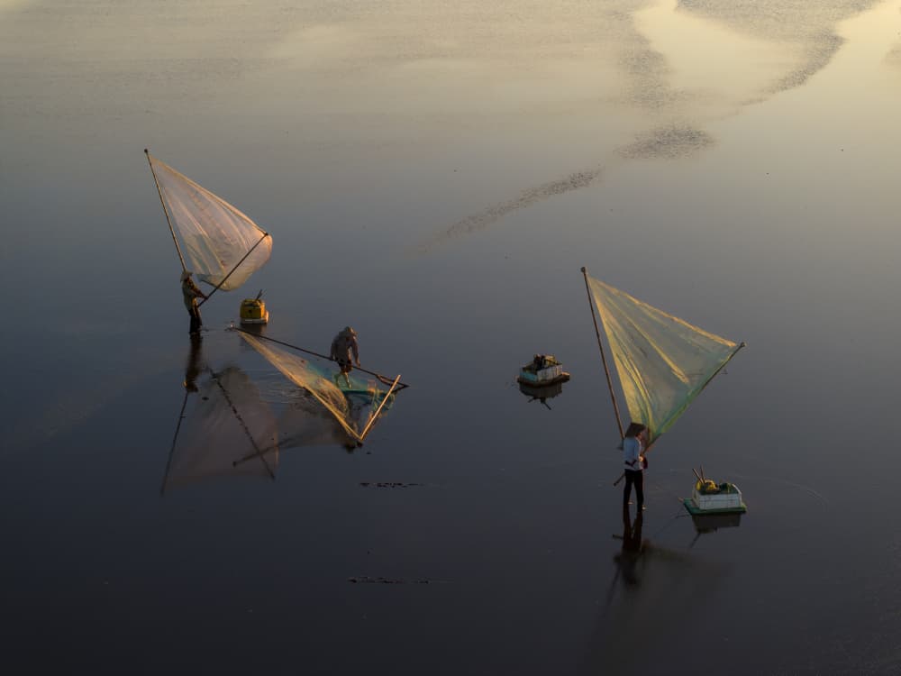 Golden Hour Fishermen by Sarawut Intarob — canvas wall art
