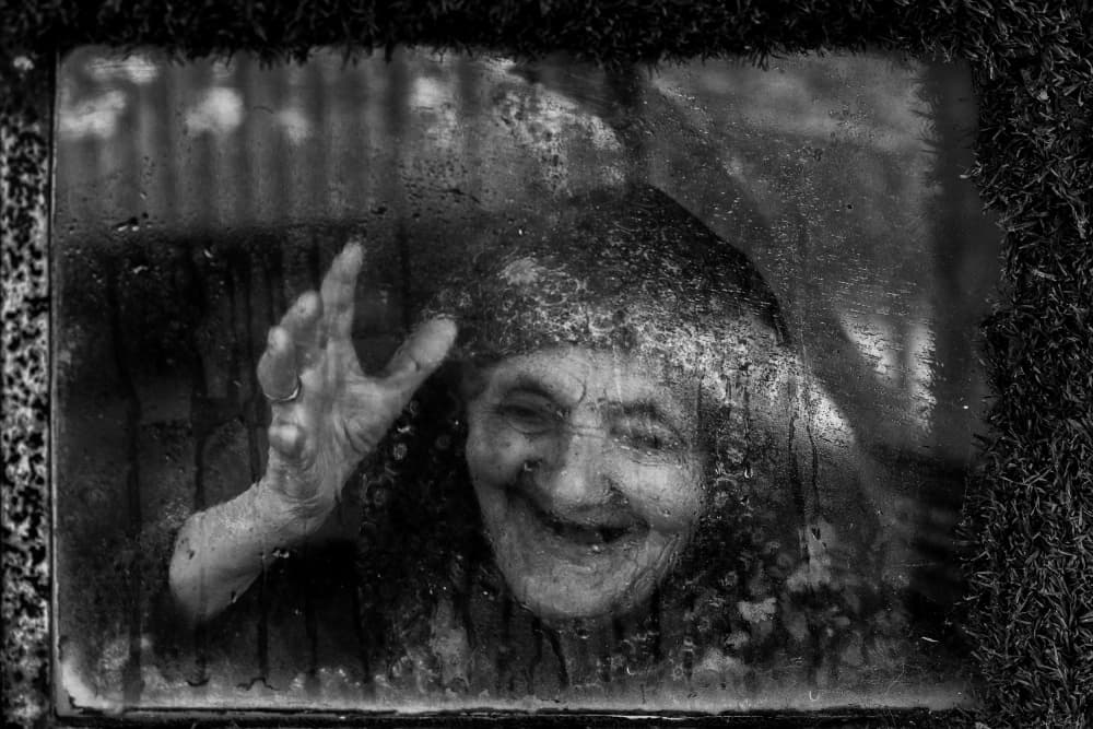 Joyful Woman Behind Glass by Ummu Nisan Kandilcioglu — canvas wall art