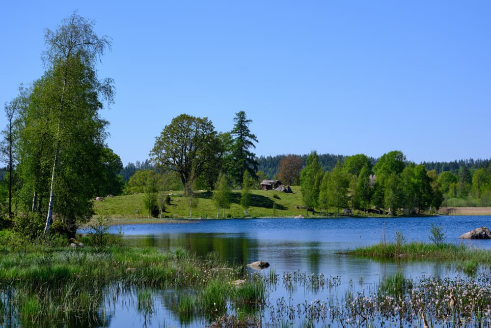 Peaceful Lakeside Cabin by Geertjan Plooijer — canvas wall art