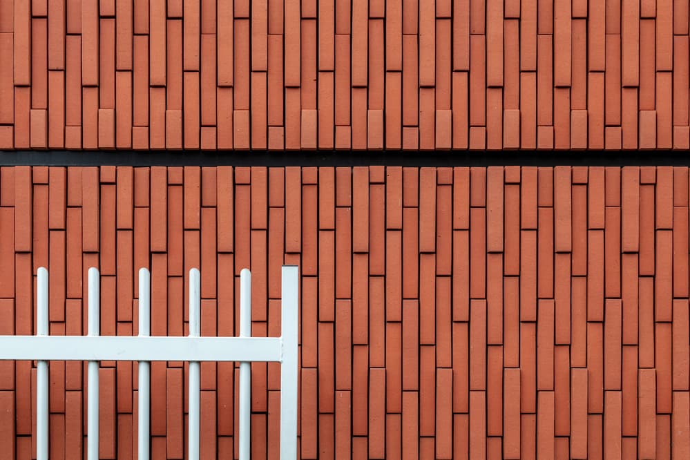 Geometric Red Brick Wall by Theo Luycx — canvas wall art